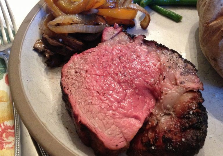 Slice of both the inside medium rare and the outside crusty and coated with Cow Lick