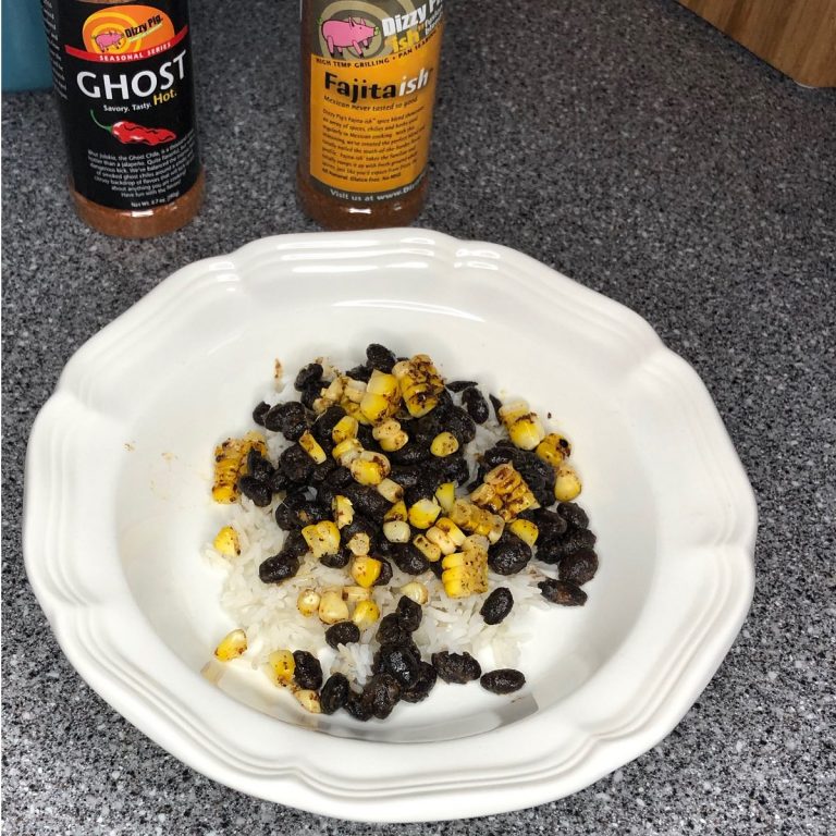 Rice base topped with beans and corn