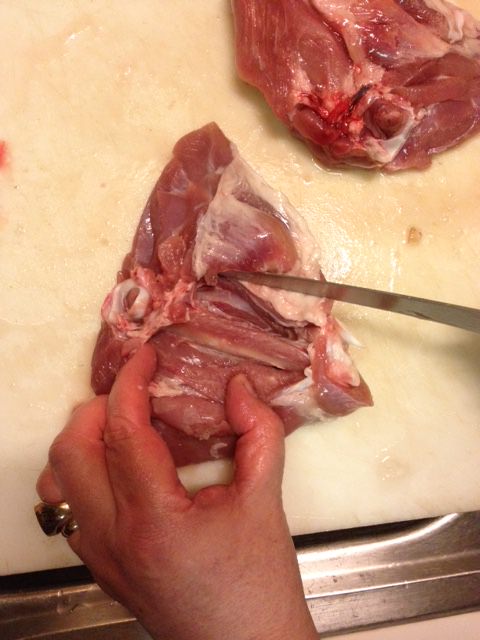 Cut the meat away from the bone without cutting all the way through