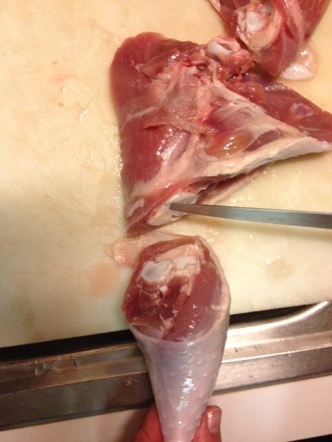 Cut through bone connecting thigh to drumstick