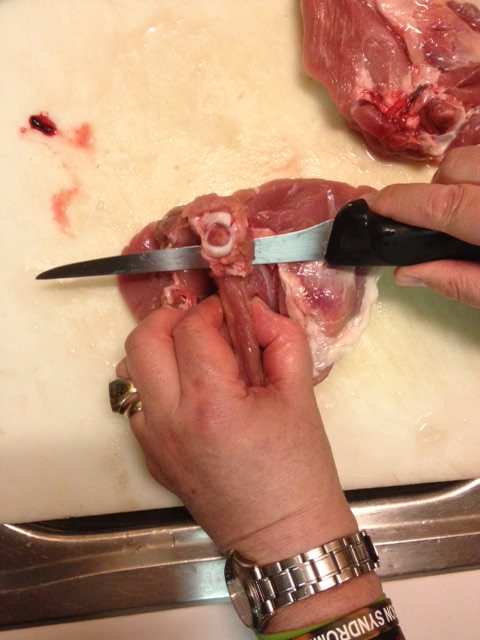 Slide knife under bone to cut through tendons