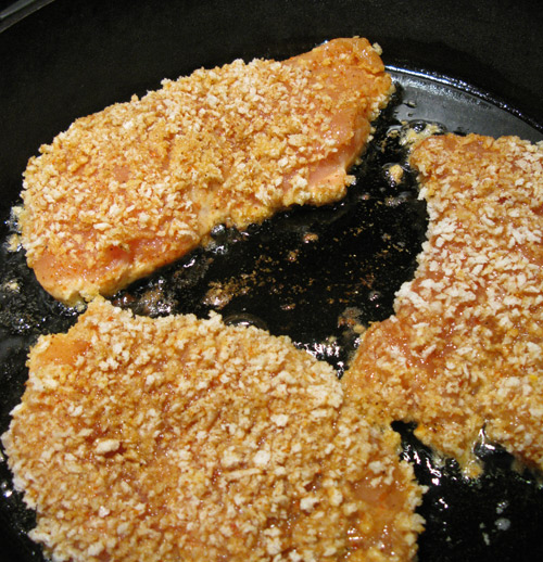 Fry chicken, keep a close eye and reduce heat if oil gets too hot
