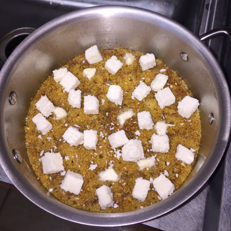 Add cheese cubes and butter. Cover pan and let sit for 10 minutes