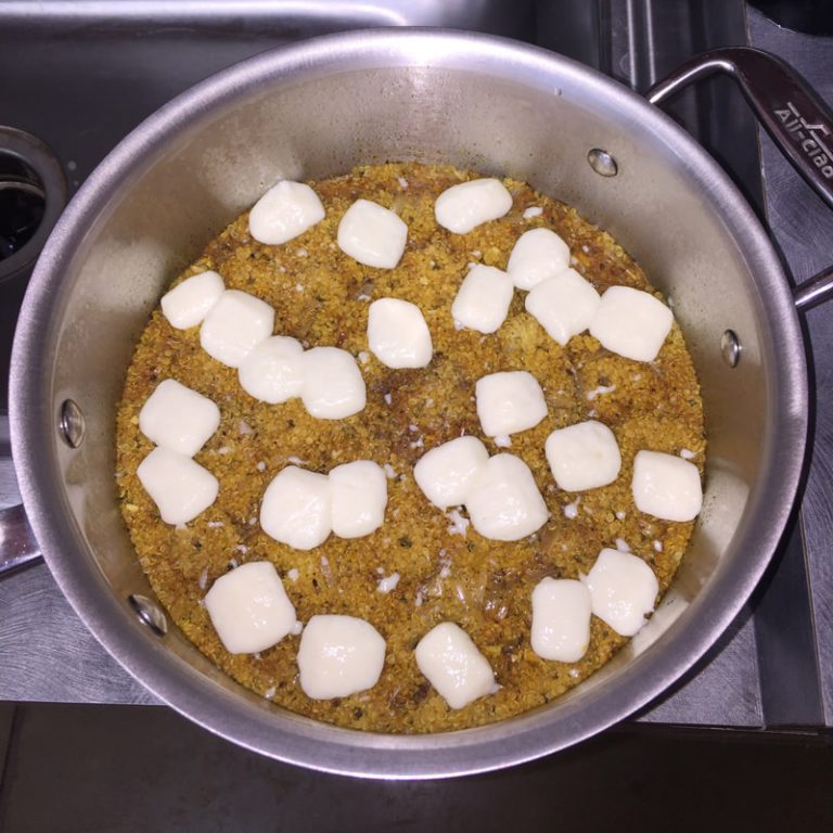 The cheese will be softened, not melted. Add toasted pine nuts and evaporated milk, then fluff with fork