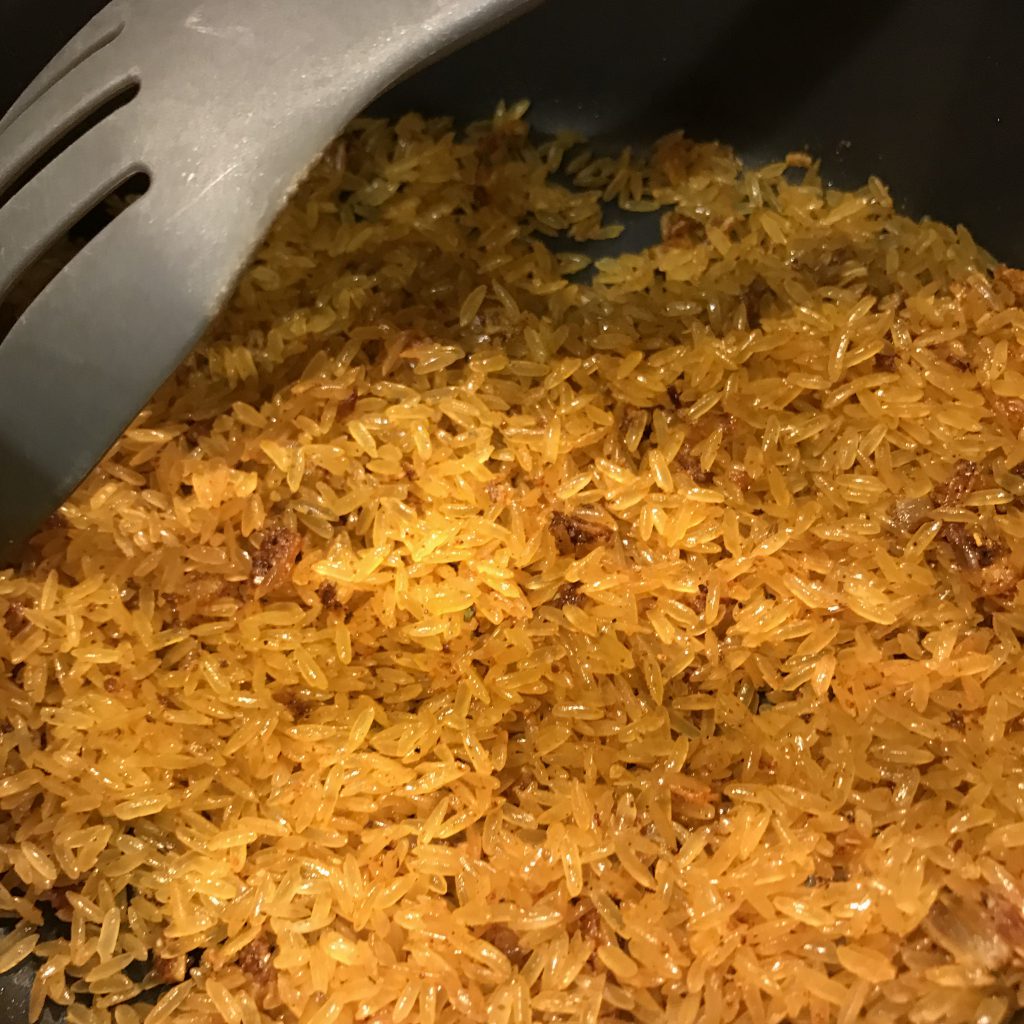 Sauté rice with onions and Peruvian-ish seasoning