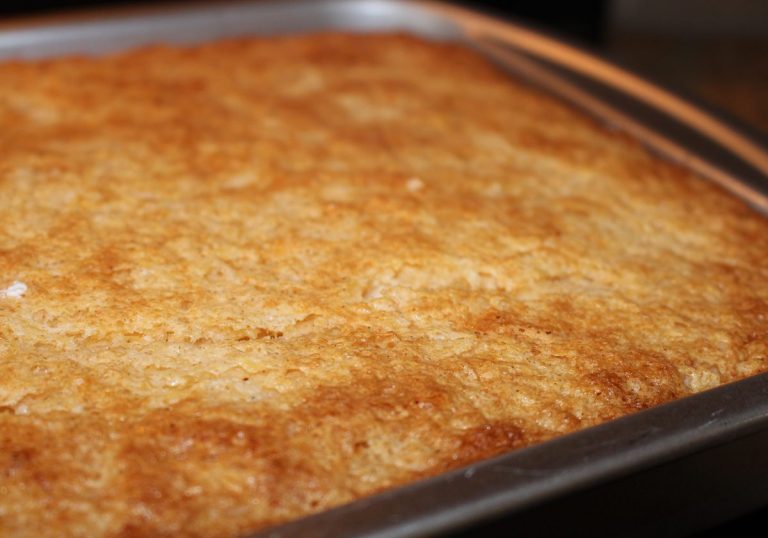 Pour batter over pineapple and cherries and bake