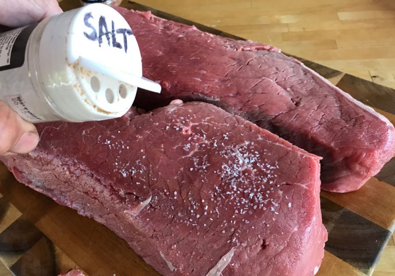 Sprinkle salt on beef