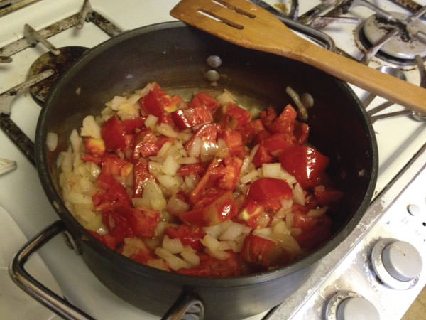 Add chopped tomatoes and cook until tender