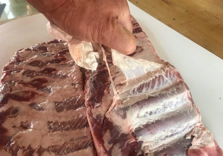 Remove membrane from bone side of ribs