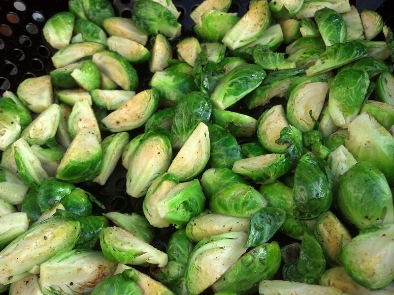Quarter the brussels sprouts and coat with olive oil