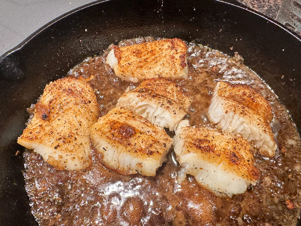 Add fish back to pan