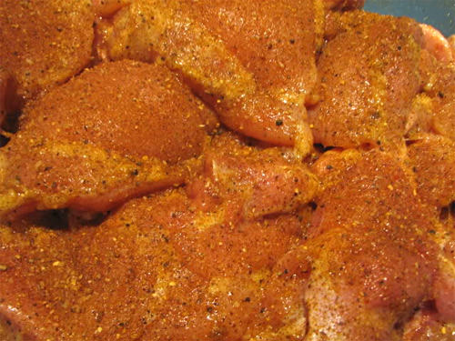 Rub chicken with oil and coat with seasoning