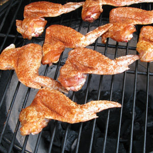 Place chicken, skin side up, on raised grate