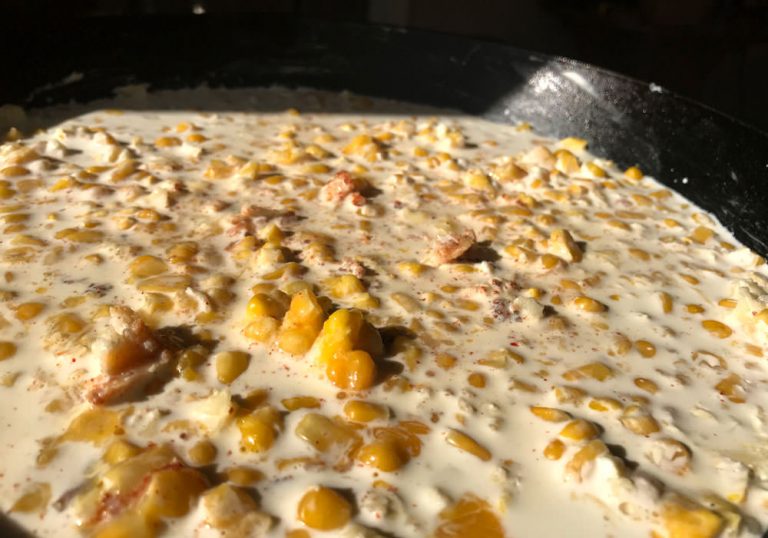 Combine half and half, melted butter and Spicy Dizzy Dust and pour over corn mixture in pan