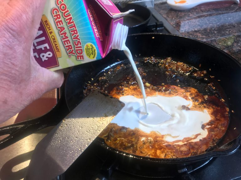 Slowly stir or whisk in half and half