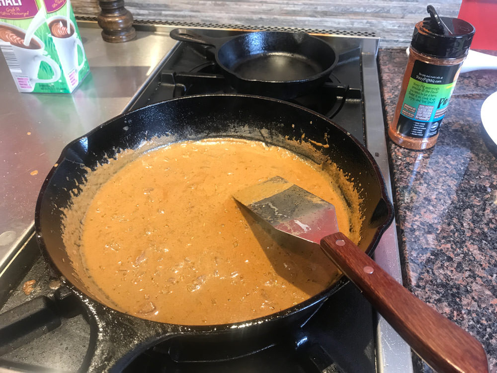 Simmer the sauce until it has thickened