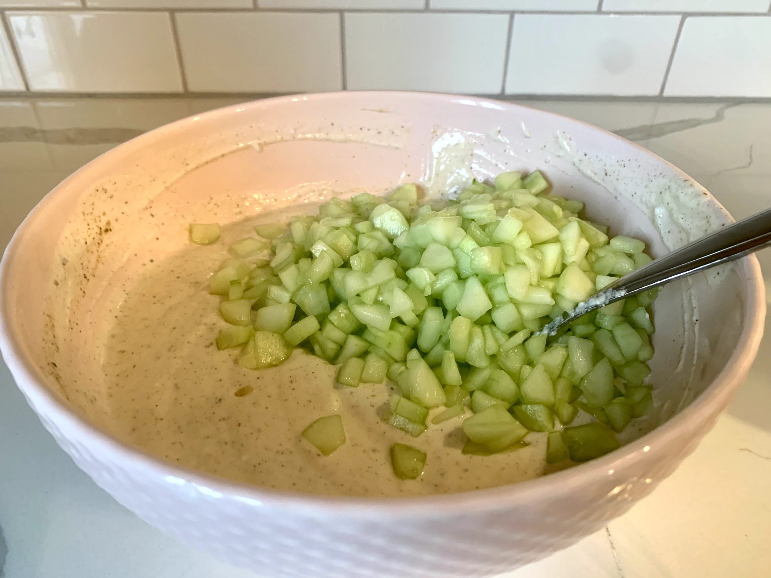 Add cucumber, garlic and mix