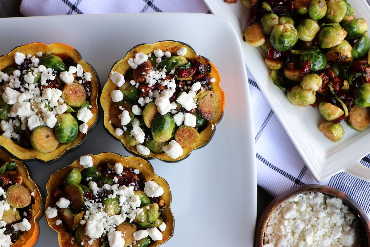 Top acorn squash bowl with crumbled goat cheese