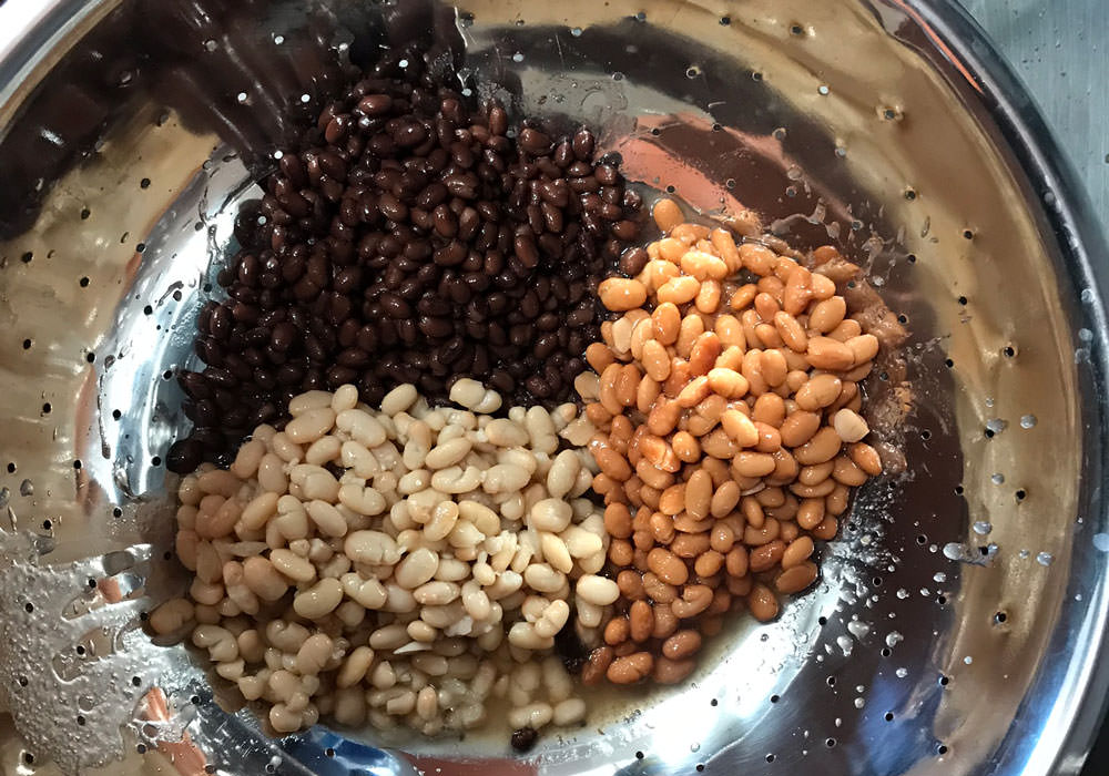Drain beans in a collander