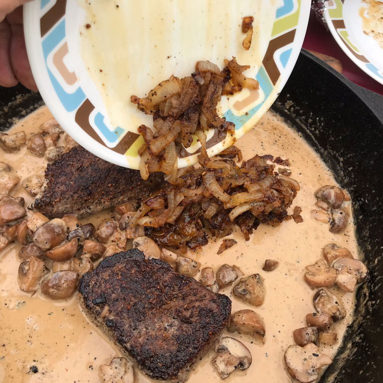 Add venison medallions and caramelized onions to the sauce