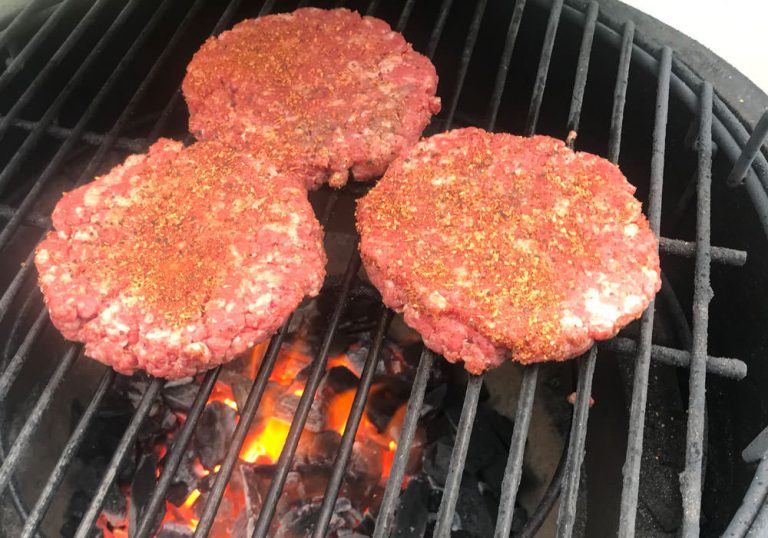 Grilled hamburgers - place burgers on grill